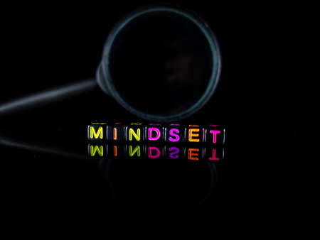 Selective focus.Word MINDSET from black dice with reflection on a black background.Shot were noise and film grain.の写真素材