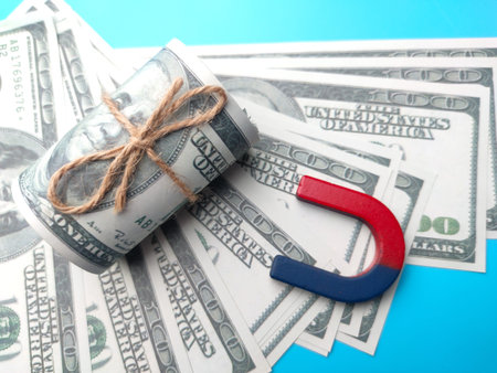 Wooden figures of people and a magnet. Team management concept. Human resources. Promote. Choosing a new leader and hiring employees to work. Headhunting services. Employee dismissal.の写真素材