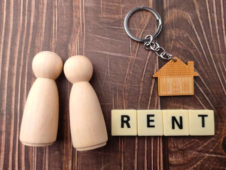 Wooden house and wooden block with word FHA on yellow background.の写真素材