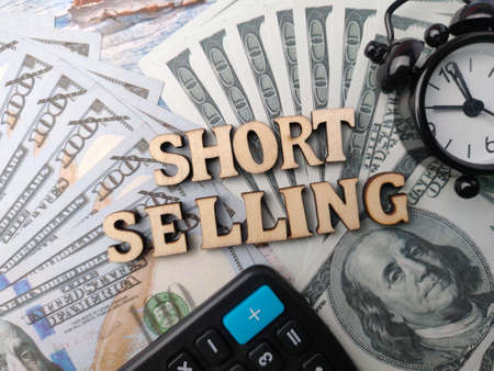 The beautiful ornamental fish is in a small storage container on a blue background.の写真素材