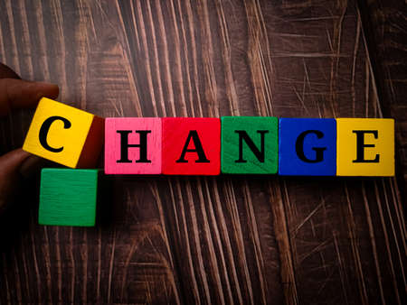 Colored wooden cube with word VERBAL on a blue background.の写真素材