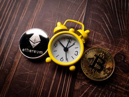 A five beautiful silver ethereum digital crypto coin on wooden table with copy space.の写真素材