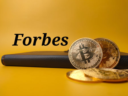 Bitcoins and world globe on a yellow background with copy space.の写真素材