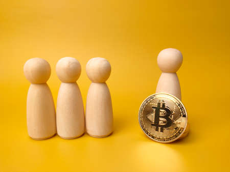 Bitcoins and world globe on a yellow background with copy space.の写真素材