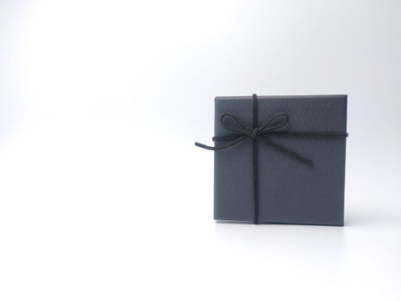 Red square and round gold box on a white background with copy space.
