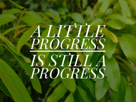 Motivation qoute.A little progress is still a progress on green leaf background.の写真素材
