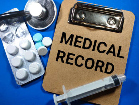 Selective focus.Word CHECKLIST with clothespins on blue board on white background.Business concept.の写真素材