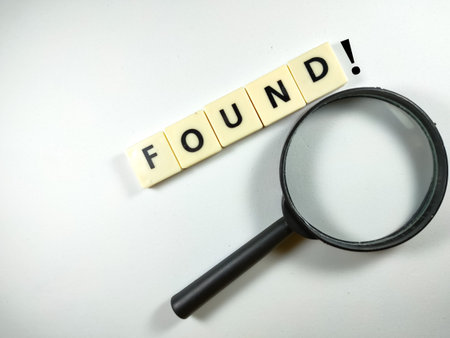 Selective focus.Word NEVER LOOK BACK with magnifying glass on white background.Business concept.