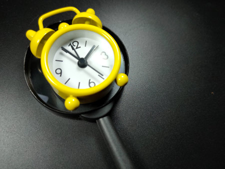 Selective focus of pencil and glasses on black background with copy space.の写真素材