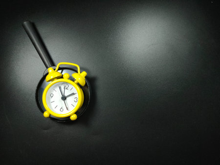 Selective focus of pencil and glasses on black background with copy space.