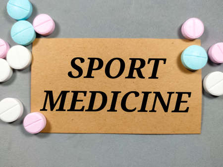 Selective focus of dollar banknote and calculator on red and white background with copy space.の写真素材