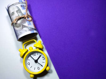 Selective focus of dollar banknote and calculator on red and white background with copy space.の写真素材