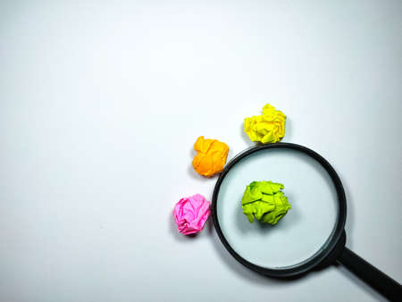 Selective focus of calculator and colored crumpled paper on white background with text space.の写真素材