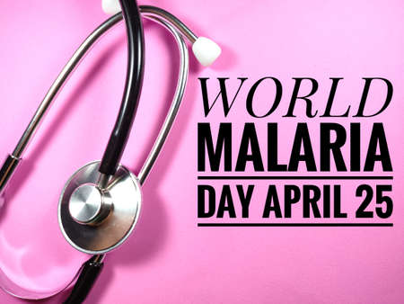 Word WORLD HEALTH DAY APRIL 7 on white background with face mask and stethoscope.の写真素材