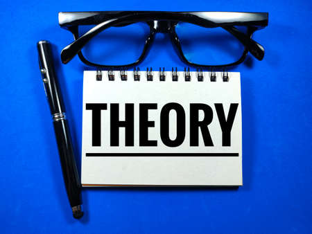 Wooden board with word Q and A on blue background with notebook,glasses and pen.Business concept.の写真素材