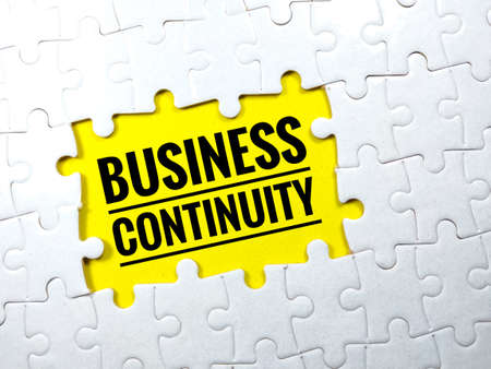 Selective focus.Word INCENTIVE with jigsaw puzzle on yellow background.Business concept.の写真素材