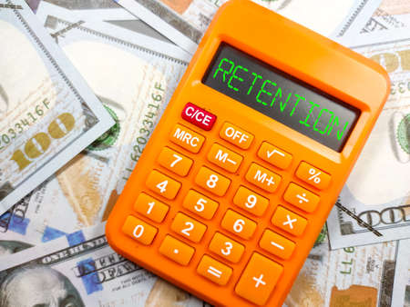 Business concept.Text CARPE DIEM with pencil,banknote and calculator on red background.の写真素材