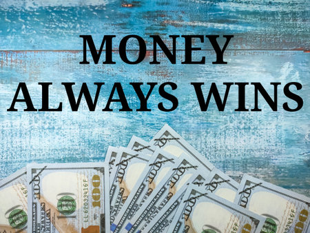 Text MONEY ALWAYS WINS with banknote on blue wooden background.