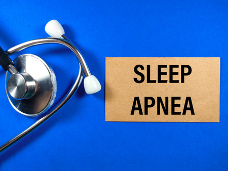 Medical concept.Text SLEEP APNEA with stethoscope on blue background.の写真素材