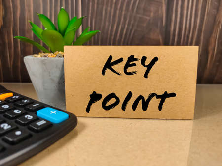 Business concept.Text KEY POINT with calculator on light table.の写真素材
