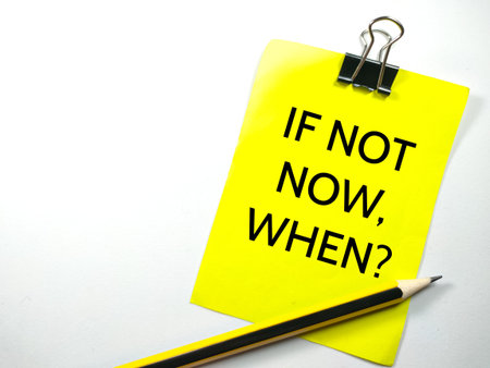 Motivated concept.Text IF NOT NOW,WHEN? on colorful paper note with pencil on white background.