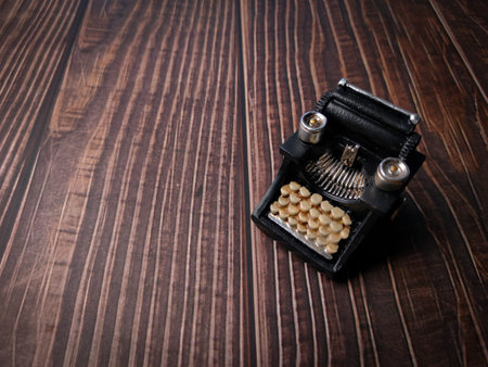 Vintage black typewriter on the wooden background, copy space for your text