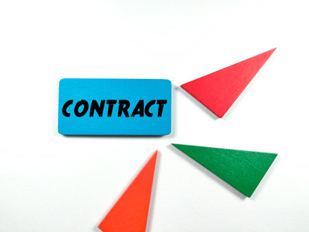 Colorful wooden board with text CONTRACT on white background.