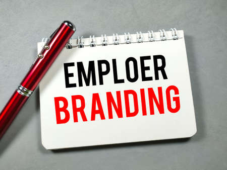Text EMPLOER BRANDING on notebook with pen on gray background.の写真素材