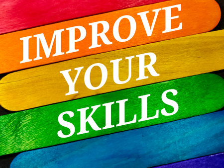 Text IMPROVE YOUR SKILLS with colorful wooden stick on black background.