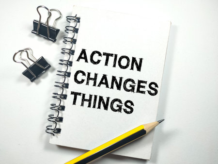 Discount concept.Text DISCOUNT % with hand holding pencil on yellow background.の写真素材