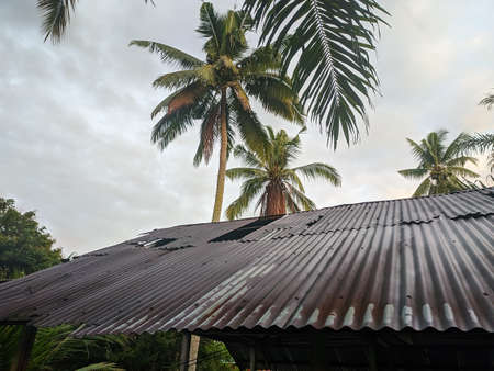 Zinc roof in a house that has been damaged due to strong winds.の写真素材