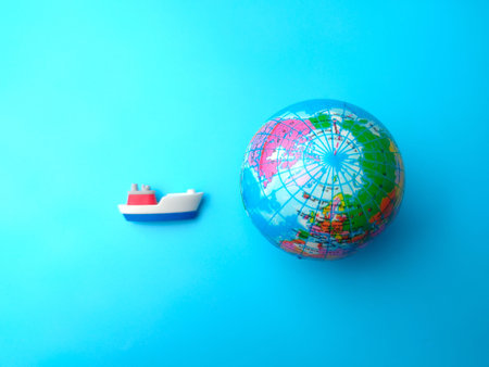 Top view ship and earth globe with text OPEN SHIPMENT on blue background.