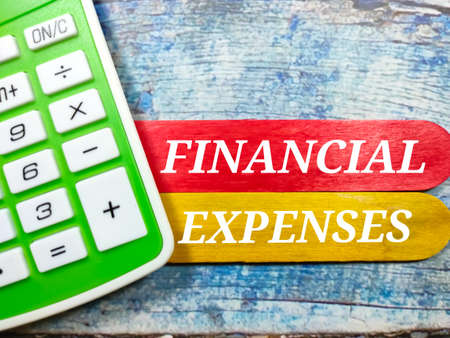 Business concept.Text LEGACY writing on block cylinder with calculator on a wooden background.の写真素材