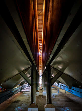 View from below the kernal palm seed storage in a factory.の写真素材