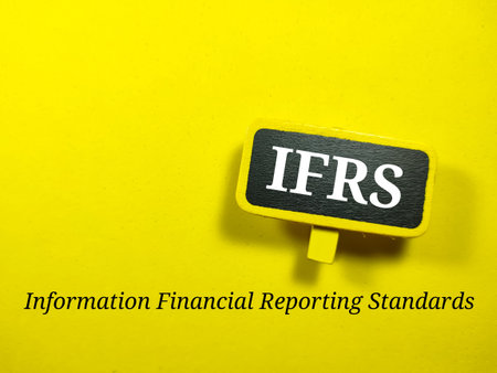Business concept.Text IFRS writing on colored wooden board on a yellow background.