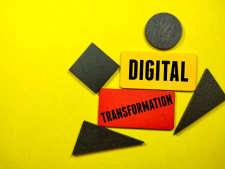 Business concept.Text DIGITAL TRANSFORMATION writing on colored wooden board with wooden puzzle on...