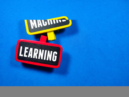Business concept.Text MACHINE LEARNING writing on colored wooden board on blue background.