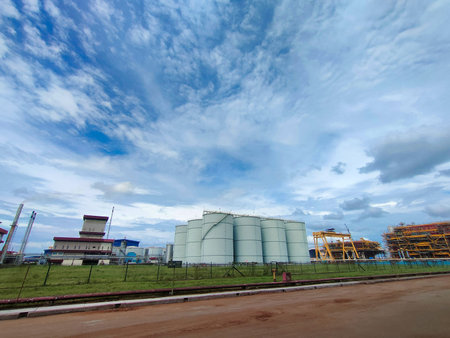 Malaysia,Perak,18 March 2022: Refinary plant and storage tank farm with blue sky background.のeditorial素材
