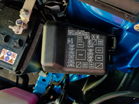 Malaysia, Perak, 16 May 2021: The fuse box of the electrical system is black on a new PRODUA ALZA...