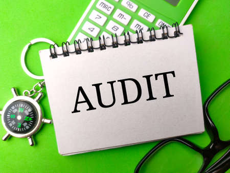 Top view calculator,glasses and compass with text AUDIT.の写真素材