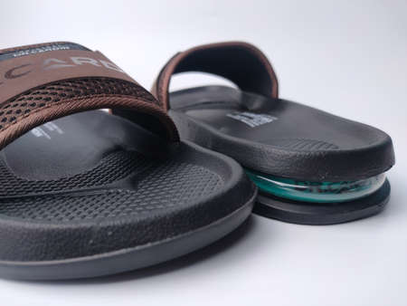 Malaysia, 26 March 2022: Dr. Cardin Comfort Air Slides Sandal on a white background.のeditorial素材