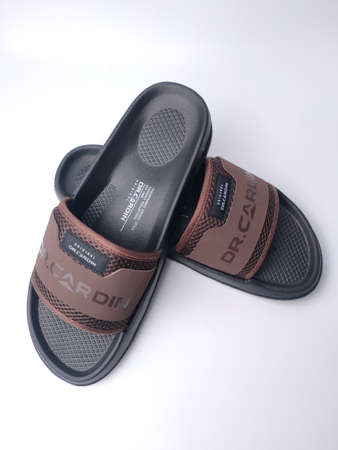 Malaysia, 26 March 2022: Dr. Cardin Comfort Air Slides Sandal on a white background.のeditorial素材