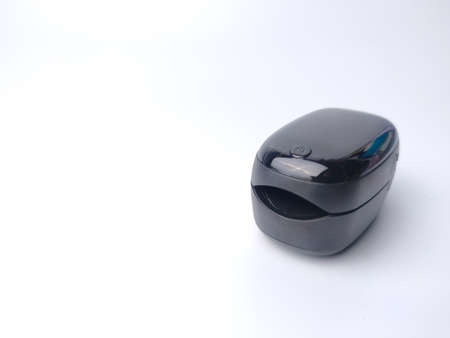 Malaysia,28 March 2022: Black oximeter on a white background with copy spaceのeditorial素材