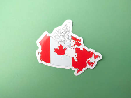 Canada flag stickers on a green background.の写真素材