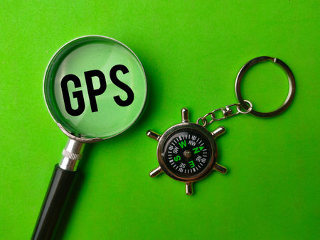 Top view compass and magnifying glass with the word GPS (Global Positioning System)の写真素材