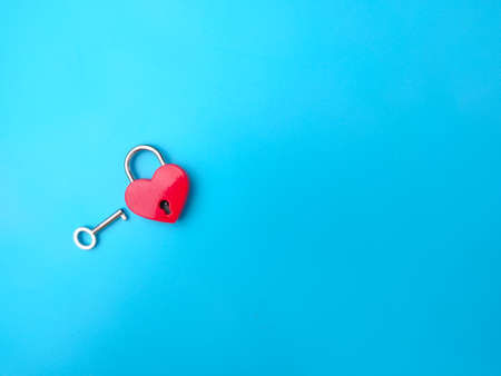Heart shaped red lock with key. Concept of love forever with padlock.の写真素材