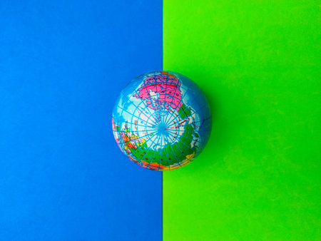 Top view earth globe on a blue and green background.の写真素材