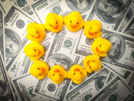 The circle yellow duck on a banknotes. Business and background texture concept.の写真素材