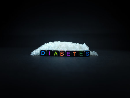 Black bead with color letter in word DIABETES with sugar and black background.Top view.の写真素材