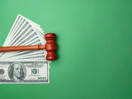 Gavel and banknotes on green background with copy space.Busines law concept.の写真素材